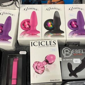 A diverse collection of wholesale sex toys, including vibrators and dildos, on a pallet.