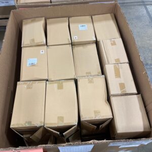 A pallet stacked with new, large white floral wholesale vases, ready for shipment.