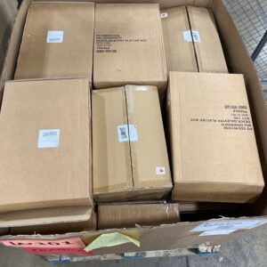 A stacked pallet of new, white, name-brand wholesale table platters ready for shipping.