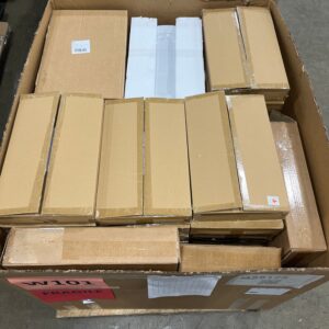 A stack of elegant, new white wholesale table platters, ready for liquidation.