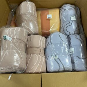 Assorted new name-brand comforters in a large wholesale comforter pallets lot.