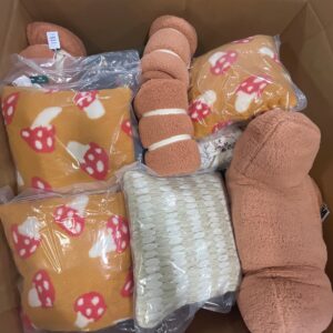 A diverse collection of new name-brand bedding items including duvet covers and quilts on wholesale bedding pallets.
