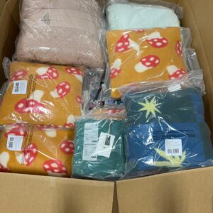 Assorted new name-brand items from wholesale bedding pallets, including sheets and comforters