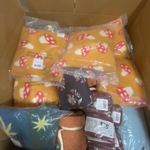 Assorted new name-brand bedding liquidation pallet, featuring duvet covers, quilts, and sheets.