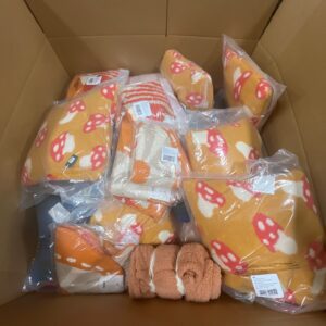 Diverse new name-brand items from wholesale bedding pallets, including duvets and sheets.