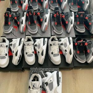 A large pallet stacked high with boxes of assorted Jordan shoes, ready for wholesale.