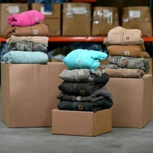 A diverse collection of Carhartt clothing pallets featuring vintage and modern workwear.