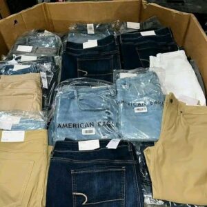 A stacked American Eagle jeans pallet showcasing various denim styles and sizes for resale.