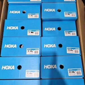 A large Hoka shoes pallet with 105 brand new, boxed Hoka shoes in various colors.
