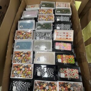 A diverse collection of new, name-brand iPhone cases from an iPhone cases liquidation pallet, showcasing various colors and styles.