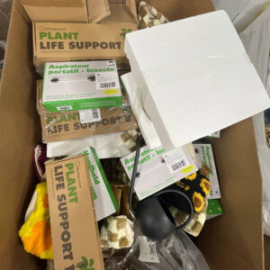 Assorted new name-brand wholesale garden products like watering cans and planters