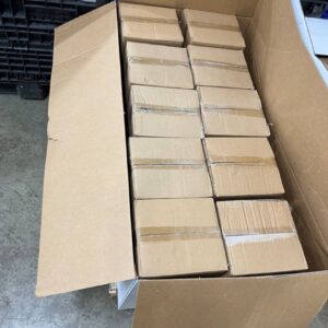A pallet stacked with boxes of new, name-brand wholesale fondue pots, ready for shipping.