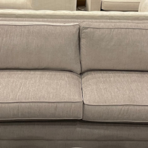 Luxurious Mitchell Gold + Bob Williams sofa from a luxury sofa liquidation, featuring Sunbrella fabric.