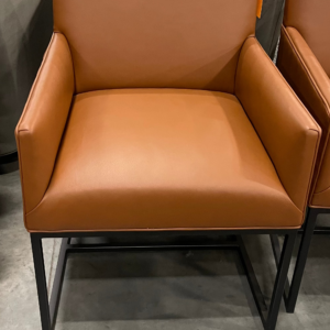 Elegant Mitchell Gold + Bob Williams armchair in Gage Low leather, perfect for luxury interiors.