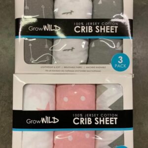 A stacked pallet of individually packaged baby crib sheets, ready for wholesale purchase.