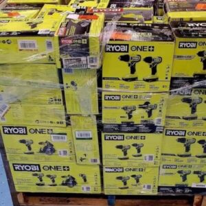A pallet stacked with various brand new Ryobi tool pallets, including drills and saws.