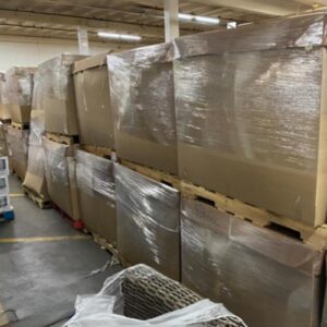 Mixed clothes liquidation pallets with men's, women's, and kids' apparel.