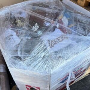 A vibrant assortment of brand new clothing on a pallet, ready for wholesale distribution.