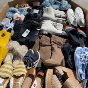 A visually appealing stack of diverse wholesale shoes pallets, containing new footwear for all ages.