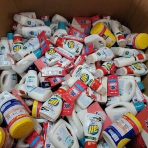 Large stack of new merchandise pallets with various consumer goods, including diapers and cleaning supplies
