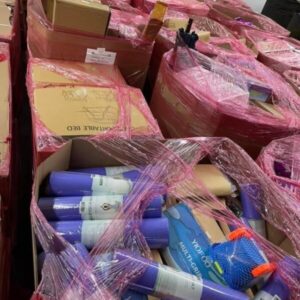 Large overstock load pallets wrapped in pink, ready for wholesale shipping from warehouse.