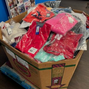 A large pallet stacked with various brand new, authentic sport clothing items, ready for bulk sale.
