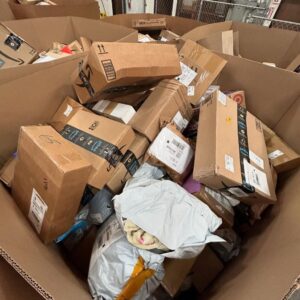 A towering GIANT DHL Mail Pallet, 5-6 feet tall, packed with diverse online returns and overstock items.