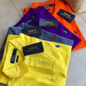 A stacked pallet overflowing with new, colorful polo shirt pallets from Lacoste and Ralph Lauren.