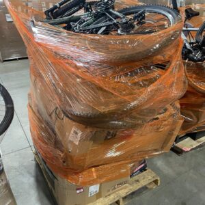 A diverse collection of outdoor gear on a wholesale sport pallet, including bikes and camping equipment.