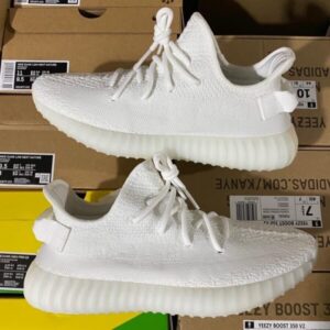 A stacked pallet of various authentic Yeezy Boost 350 v2 sneakers, ready for wholesale