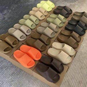Authentic Yeezy Slides wholesale pallet, 100 pairs neatly stacked in original boxes.